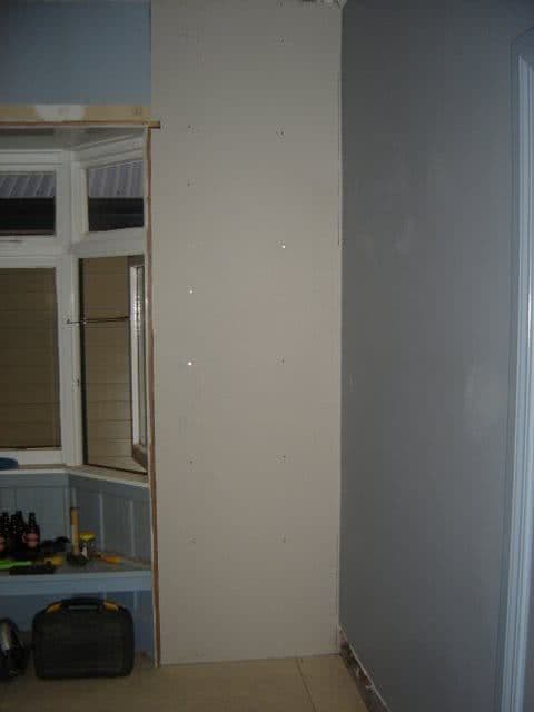 Wall with new plaster board in place